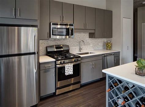 gray kitchen cabinets with stainless steel appliances pine backsplash|gray kitchen cabinets houston.